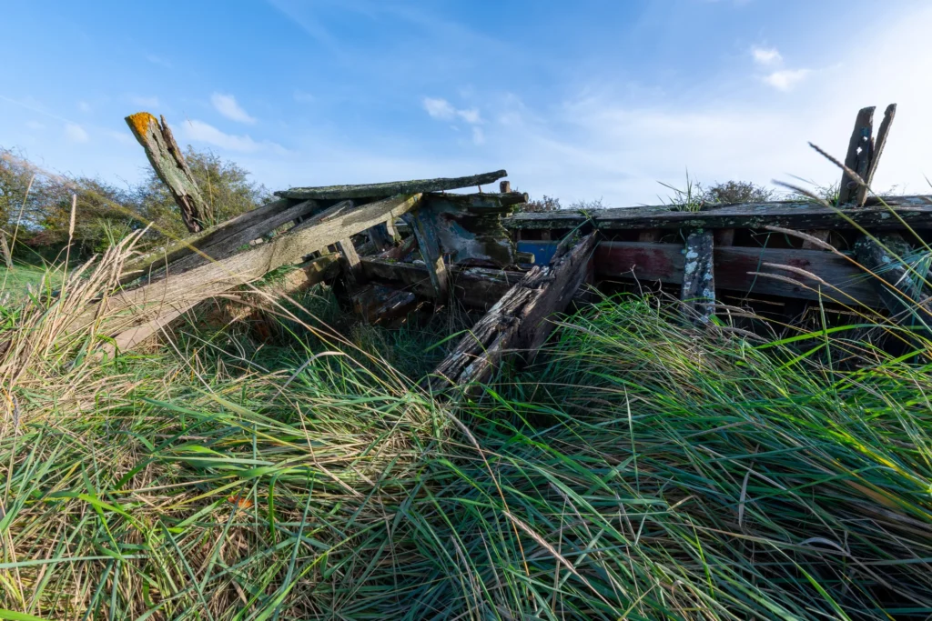 Exploring Decay and Beauty at Purton Ship Graveyard in October purton ship graveyard abandoned wooden boat